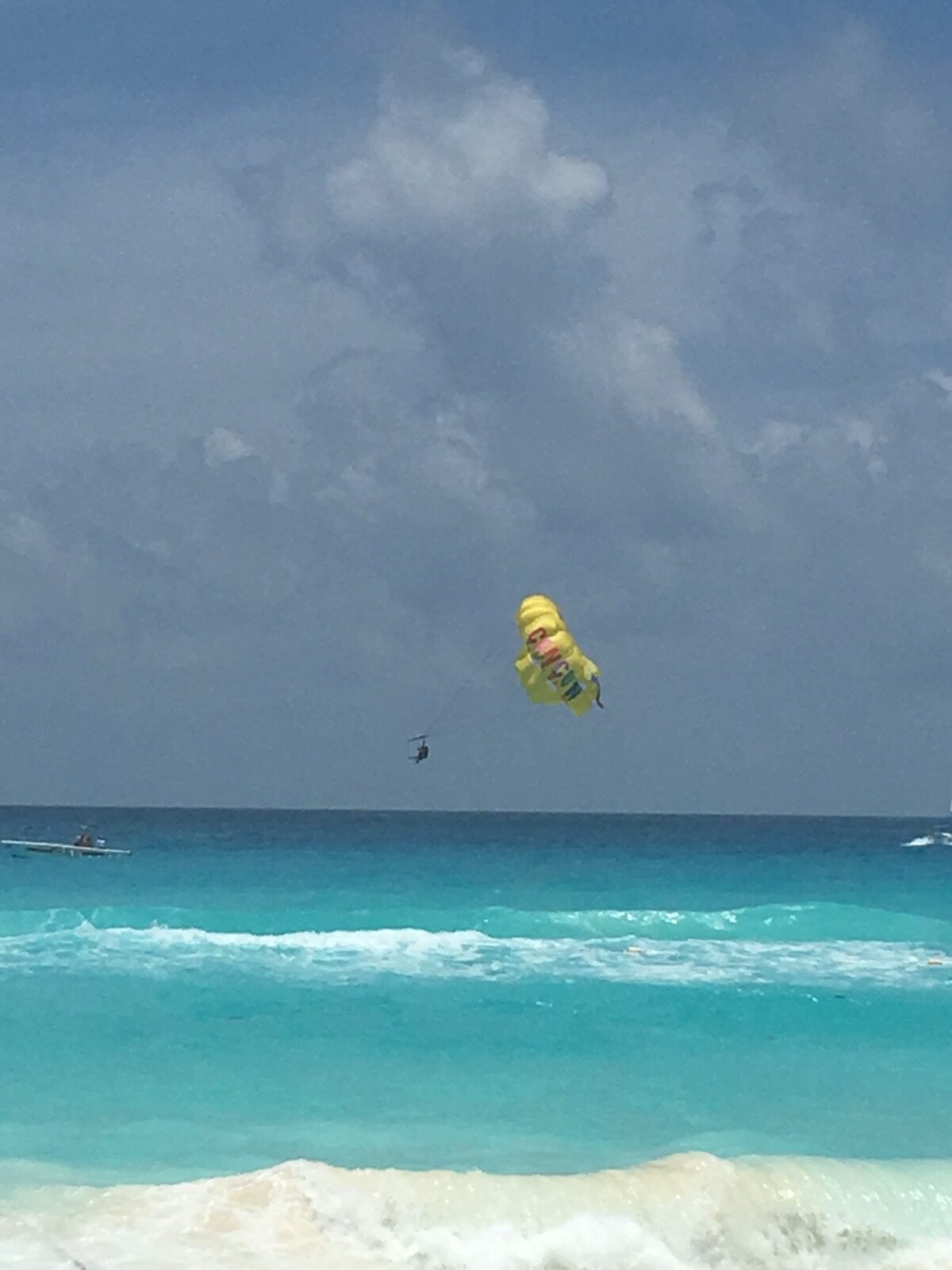 Parasailing over the water in Cancun