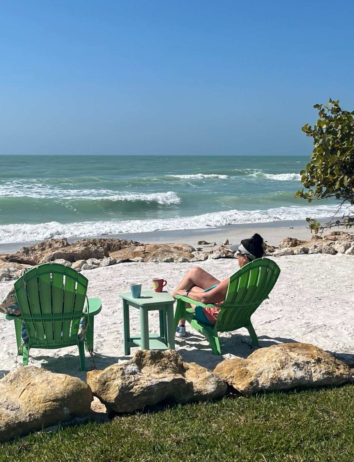 Jacque relaxing in a beach chair by the ocean